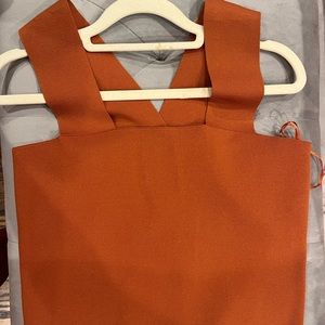 Burt orange sleeveless House of Harlow top